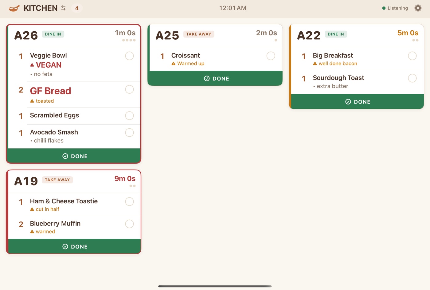 The kitchen display showing live orders as cards, running over the local network